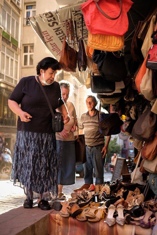 Women Standing Beside the Store 