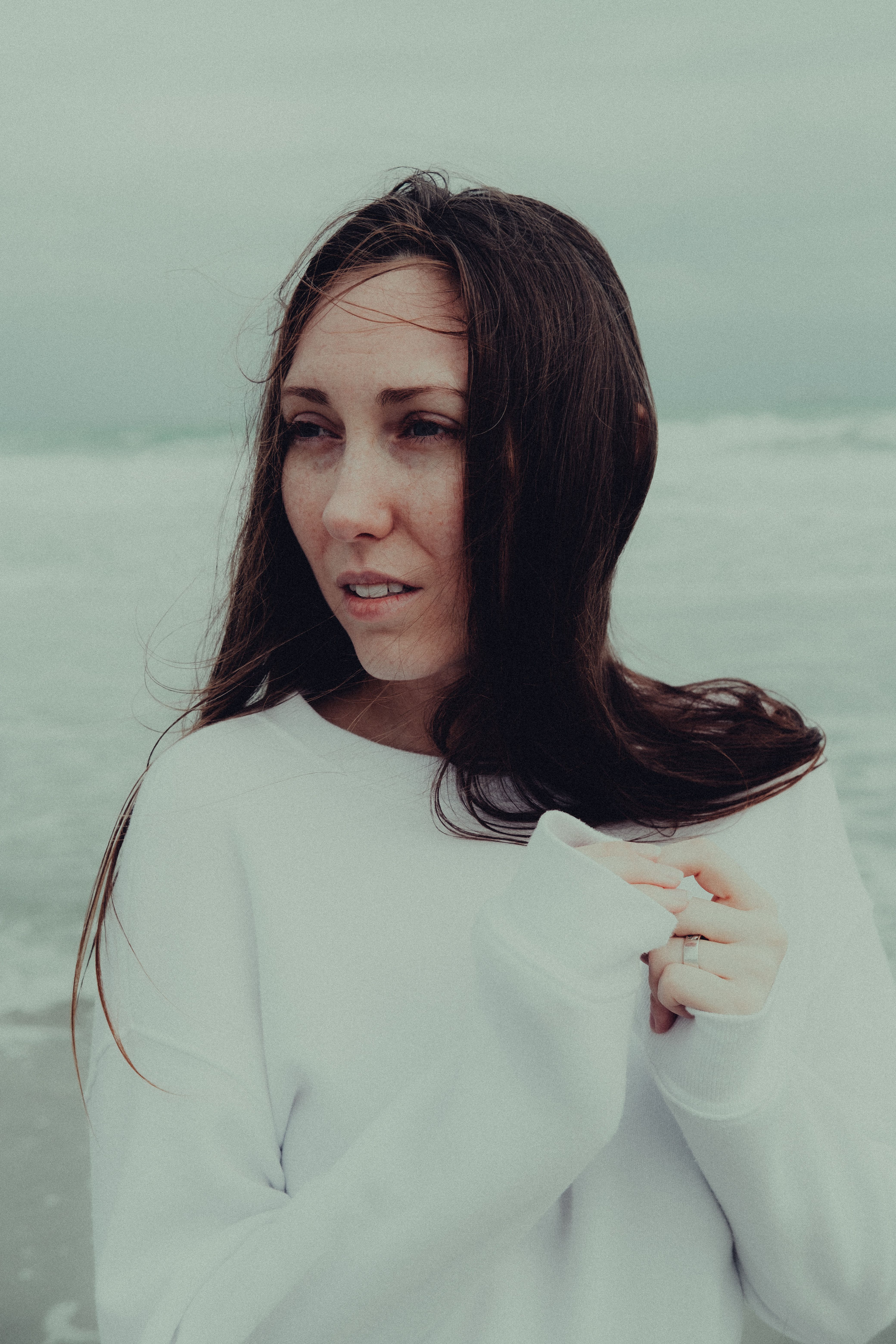 Woman in White Long Sleeve Shirt on Beach · Free Stock Photo