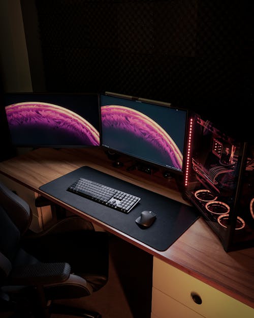 Computer Monitors on a Wooden Desk