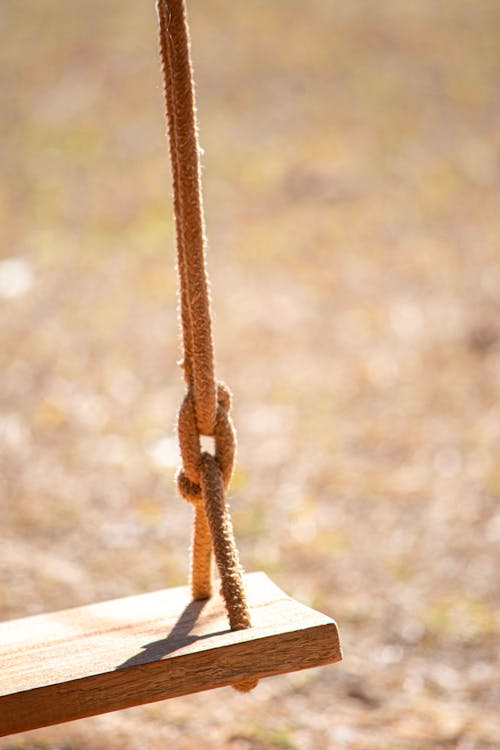 Close-up of a Wooden Seat on a Swing