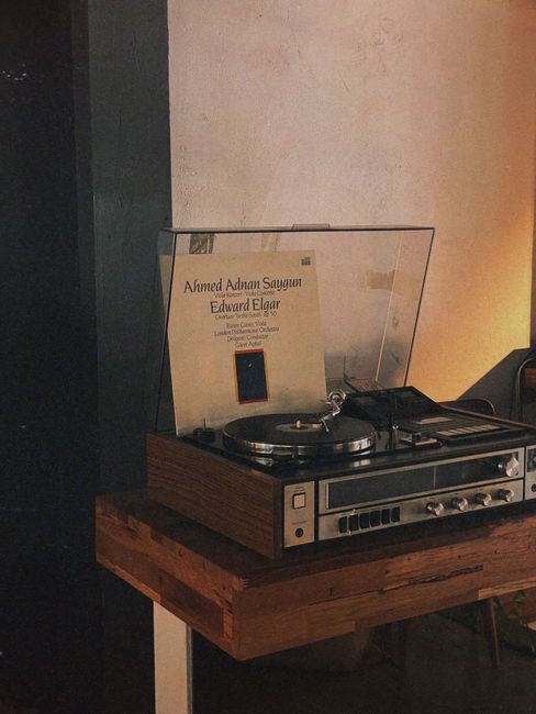 Cozy indoor scene of a vintage record player playing a vinyl album.