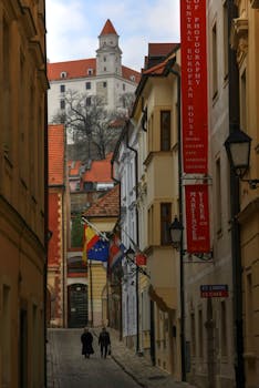Charming street in Bratislava with a view of the iconic Bratislava Castle in Slovakia.