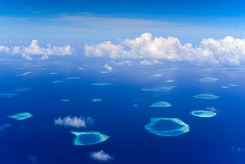 Aerial Photography of Blue Ocean under the Cloudy Sky