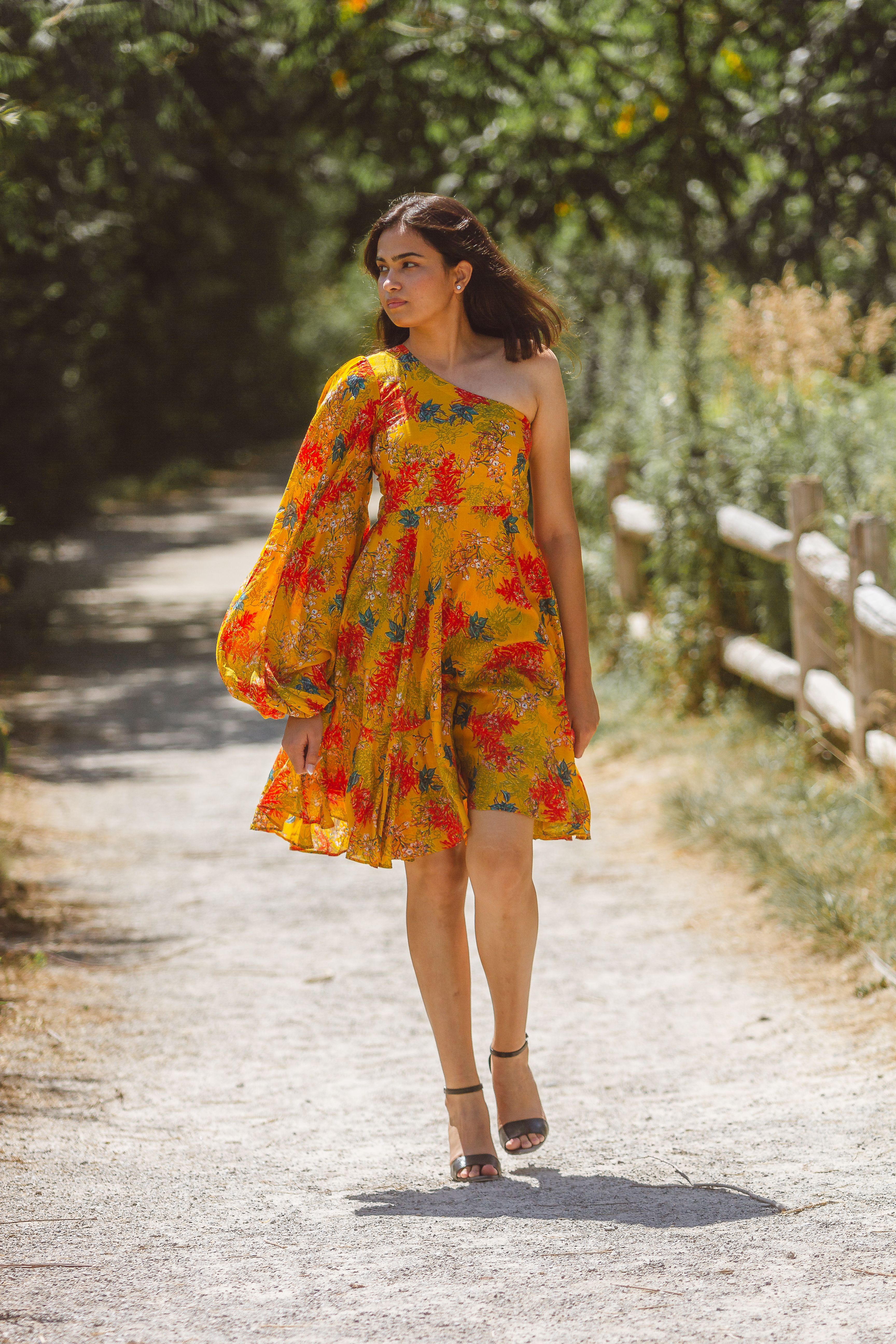 Woman in Floral Dress Walking on the Dirt Road · Free Stock Photo