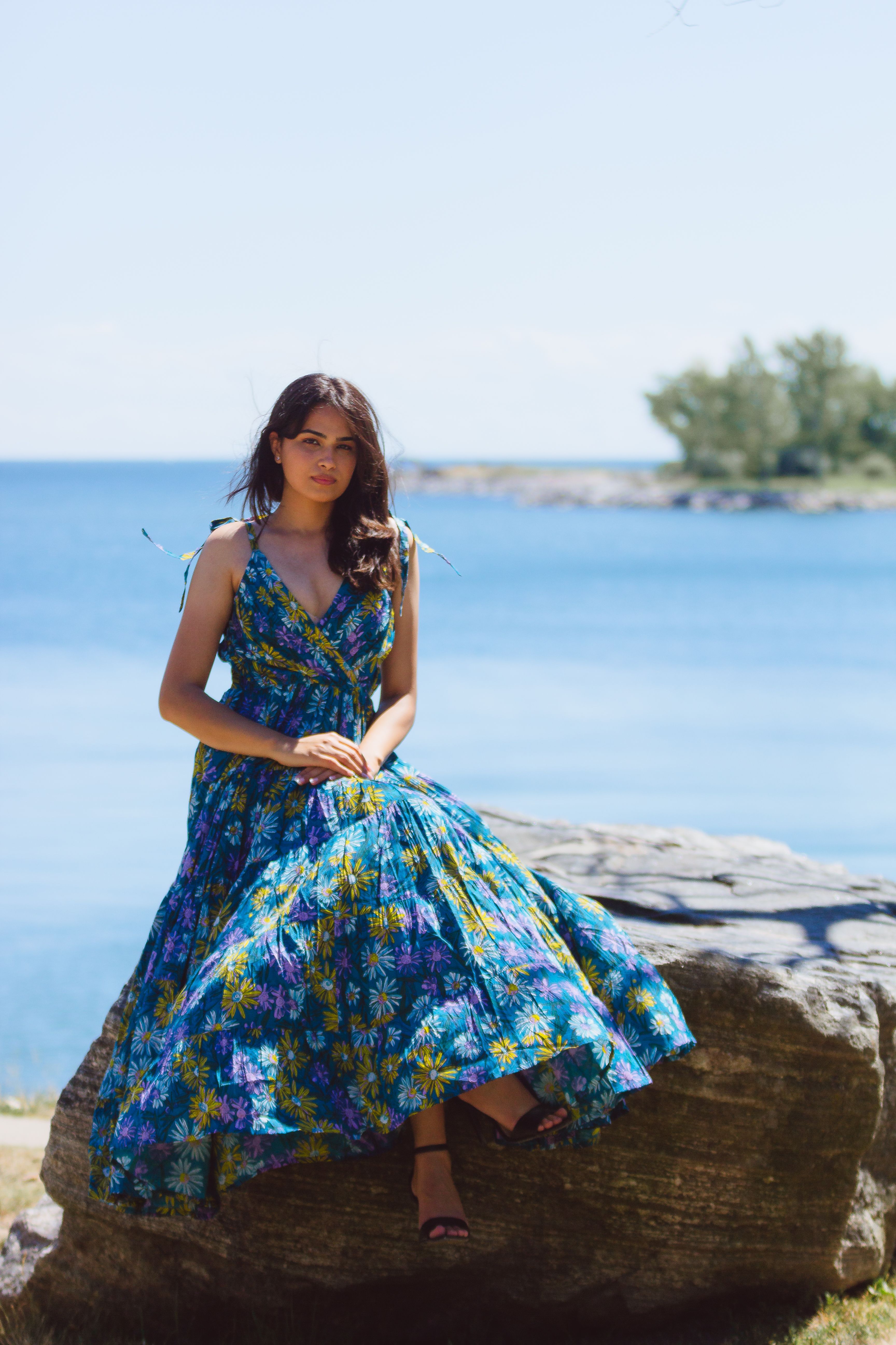 Woman Wearing Floral Dress while Sitting on the Rock · Free Stock Photo