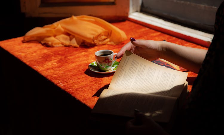 A Person Reading A Book 