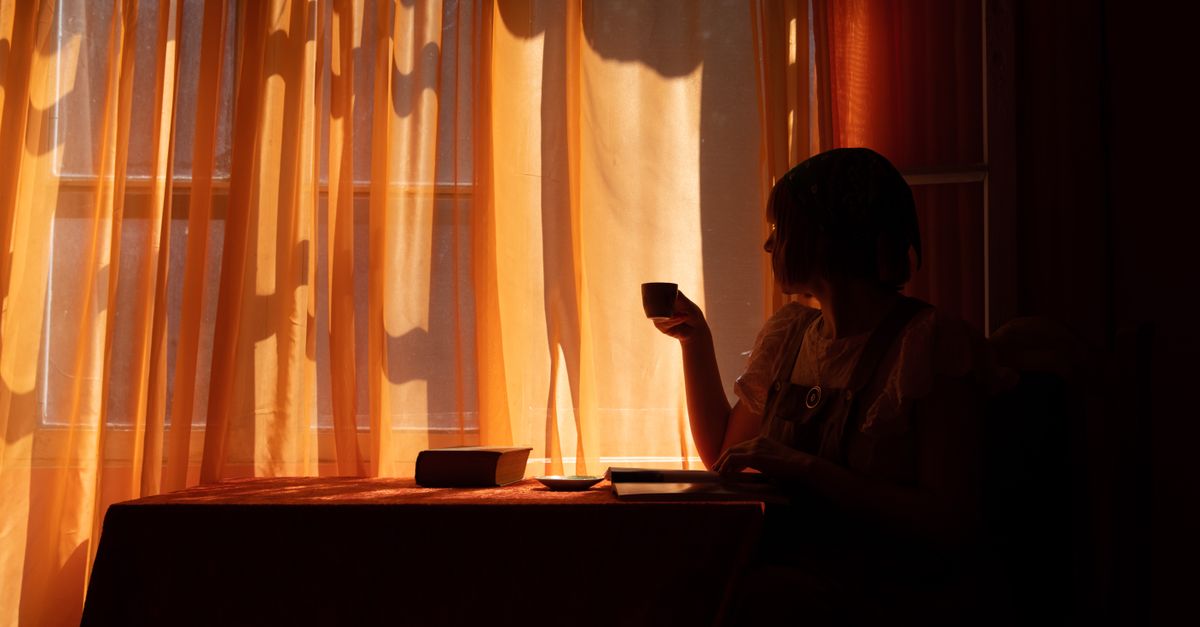 quiet morning sunlight through linen curtains coffee cup