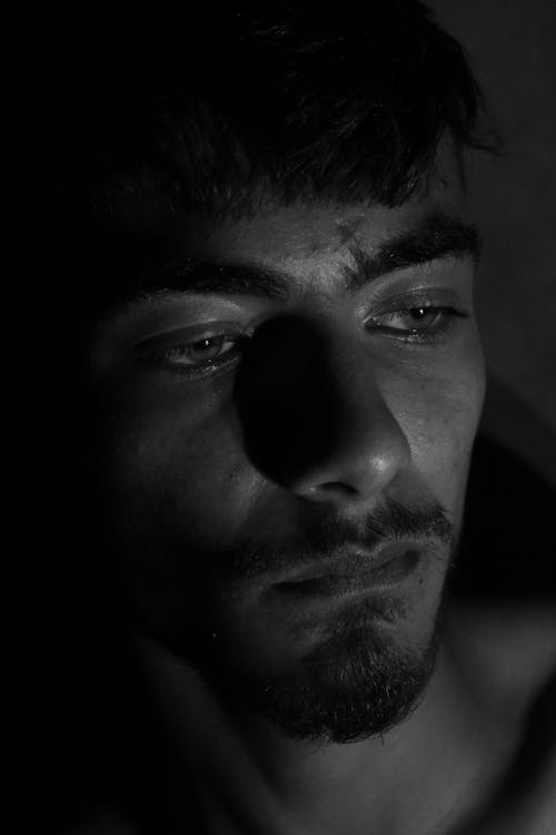 A Man's Face in Grayscale Photography