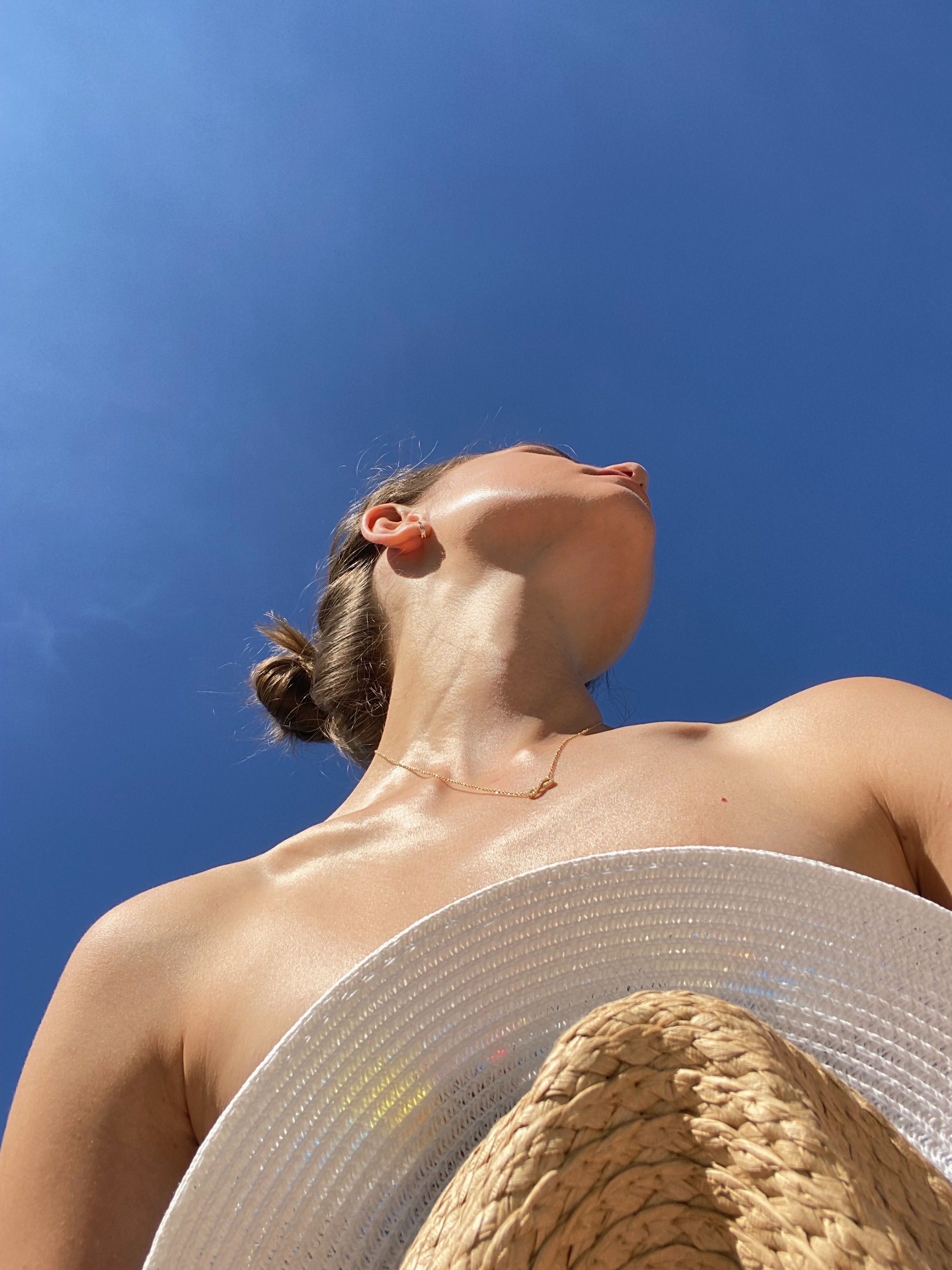 Low-Angle Shot of a Shirtless Woman · Free Stock Photo