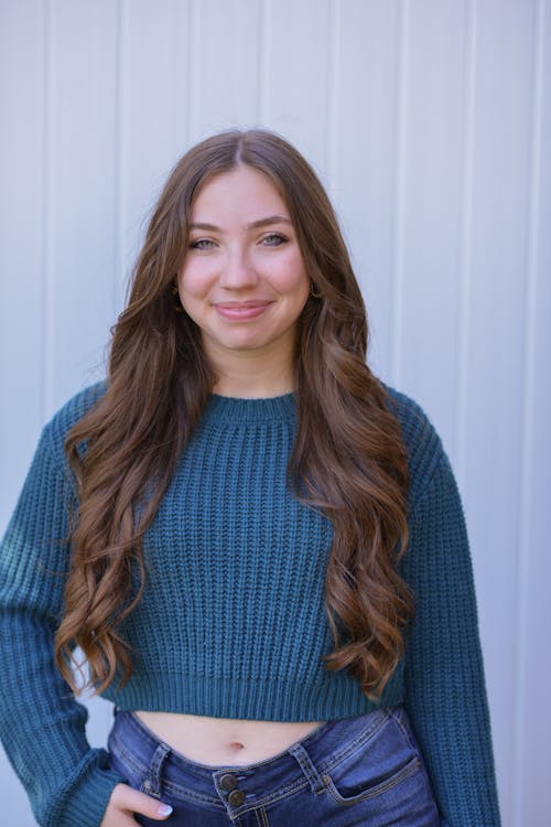 A Portrait of a Woman Wearing Knitted Sweater