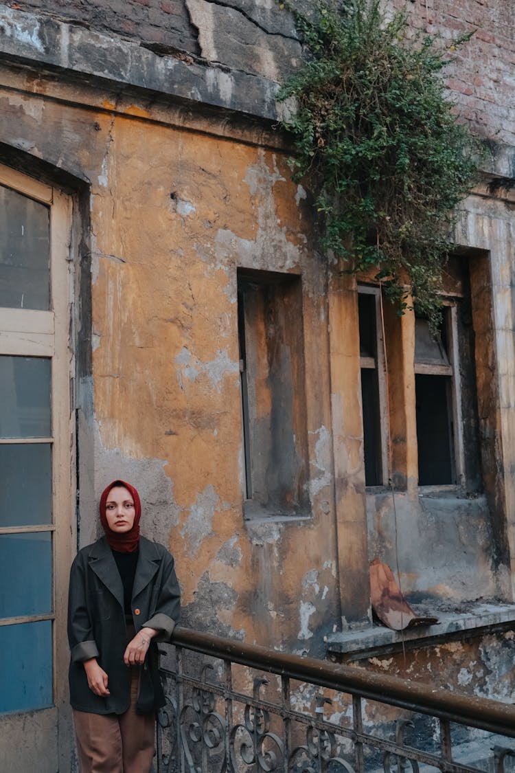 Woman In Hijab Posing Near Old Abandoned Building 