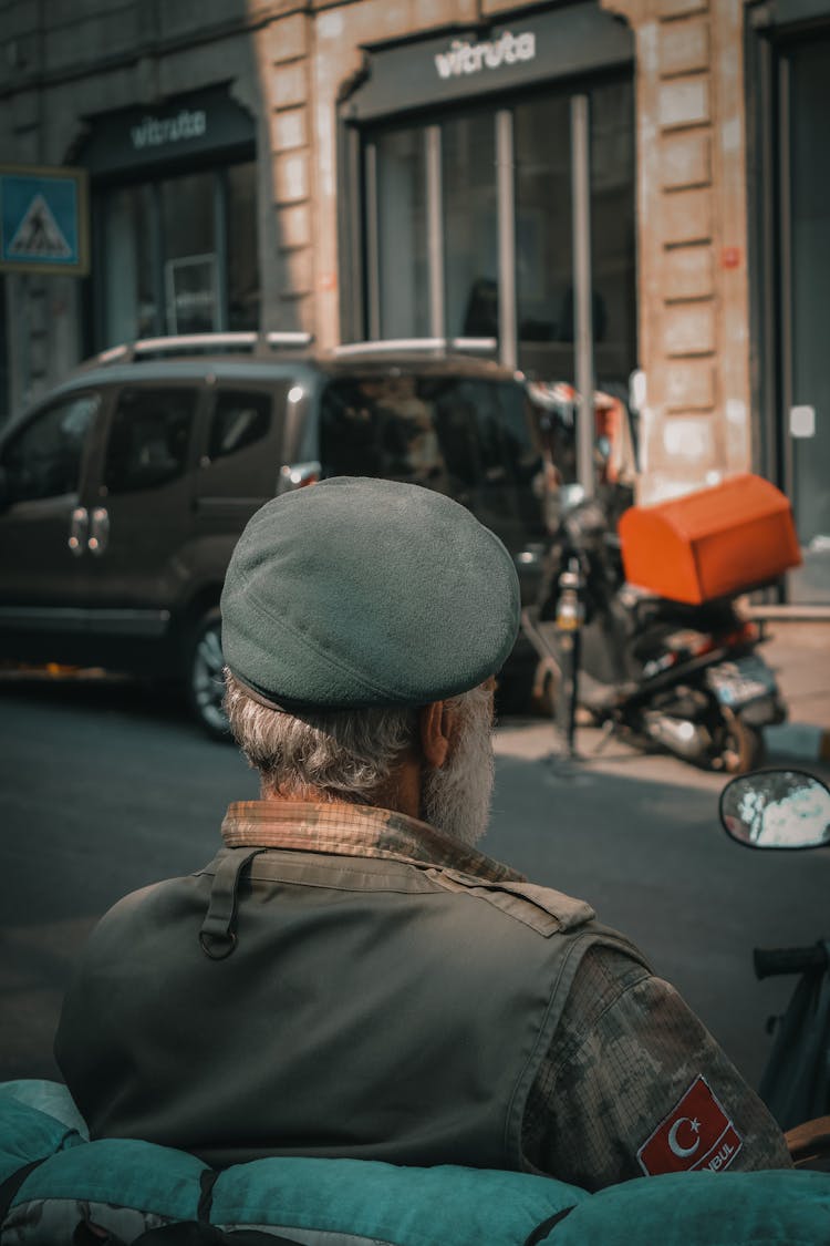 Senior Man Riding In Motorcycle In Military Uniform