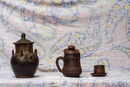 Hand-thrown ceramic vessels on a table, photo by Arturo Añez. on Pexels