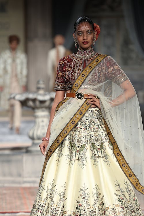 Fashion Model on Elegant Embroidered Long Gown Posing on Stage