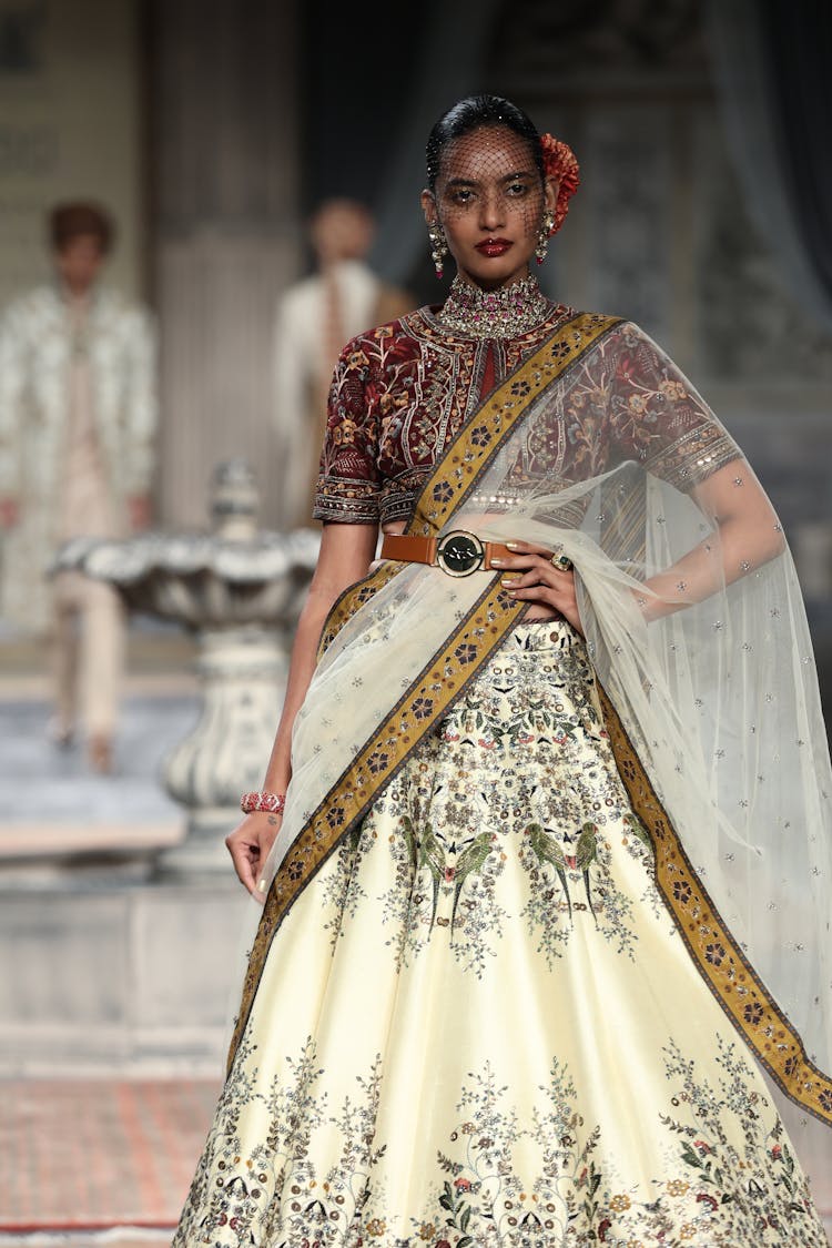 Fashion Model On Elegant Embroidered Long Gown Posing On Stage