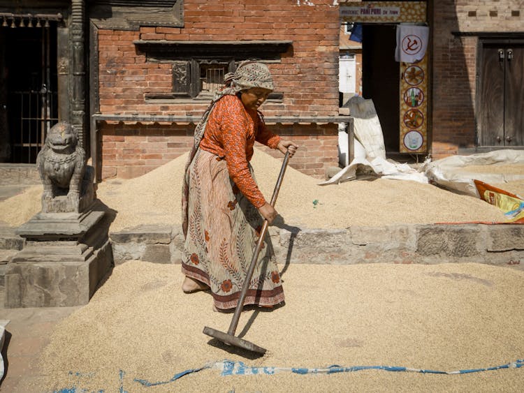 Woman Working With Sand Outdoors