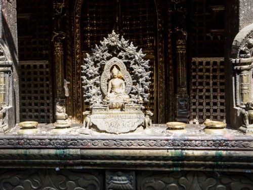 Free Close-up of a detailed Buddha statue in an ornately carved temple capturing spirituality and peace. Stock Photo