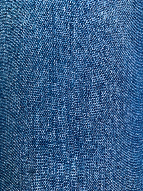 Blue Denim Textile in Close Up Photography