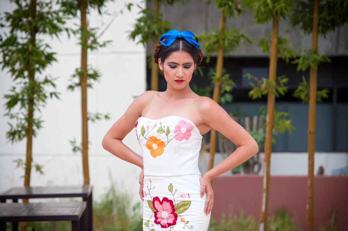 Woman In White Sweetheart Neckline Dress