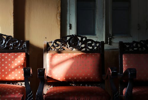 Free Red and Black Armchairs Outside the House Stock Photo