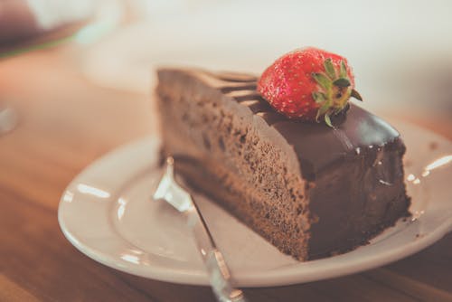 Free Sliced Chocolate Cake on Ceramic Saucer  Stock Photo