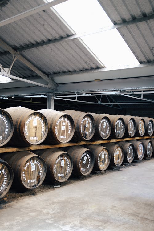 Stacks of Brown Barrels in the Storage Room