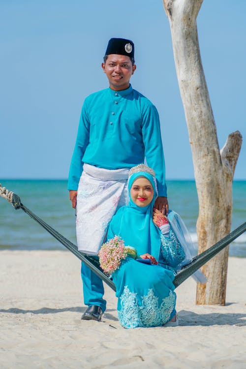 Portrait of a Bride and Groom Wearing Traditional Wedding Dress