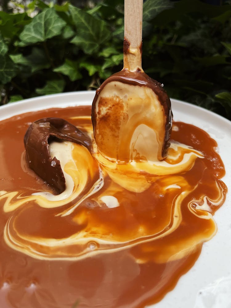 Melted Ice Cream On White Ceramic Plate 