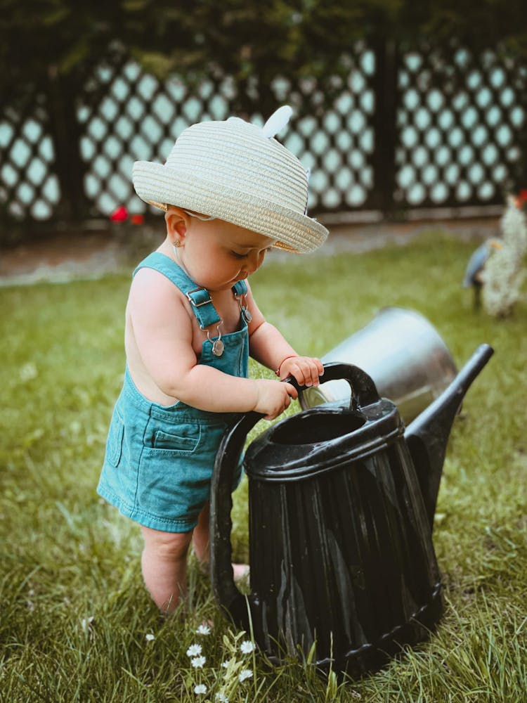 Baby Girl With Watering Can