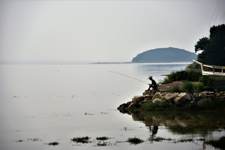 Photo Of A Person Fishing