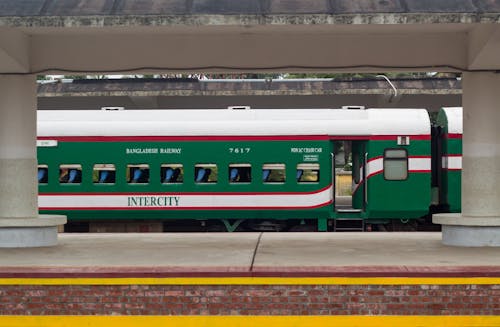 A Photo of a Moving Green Train