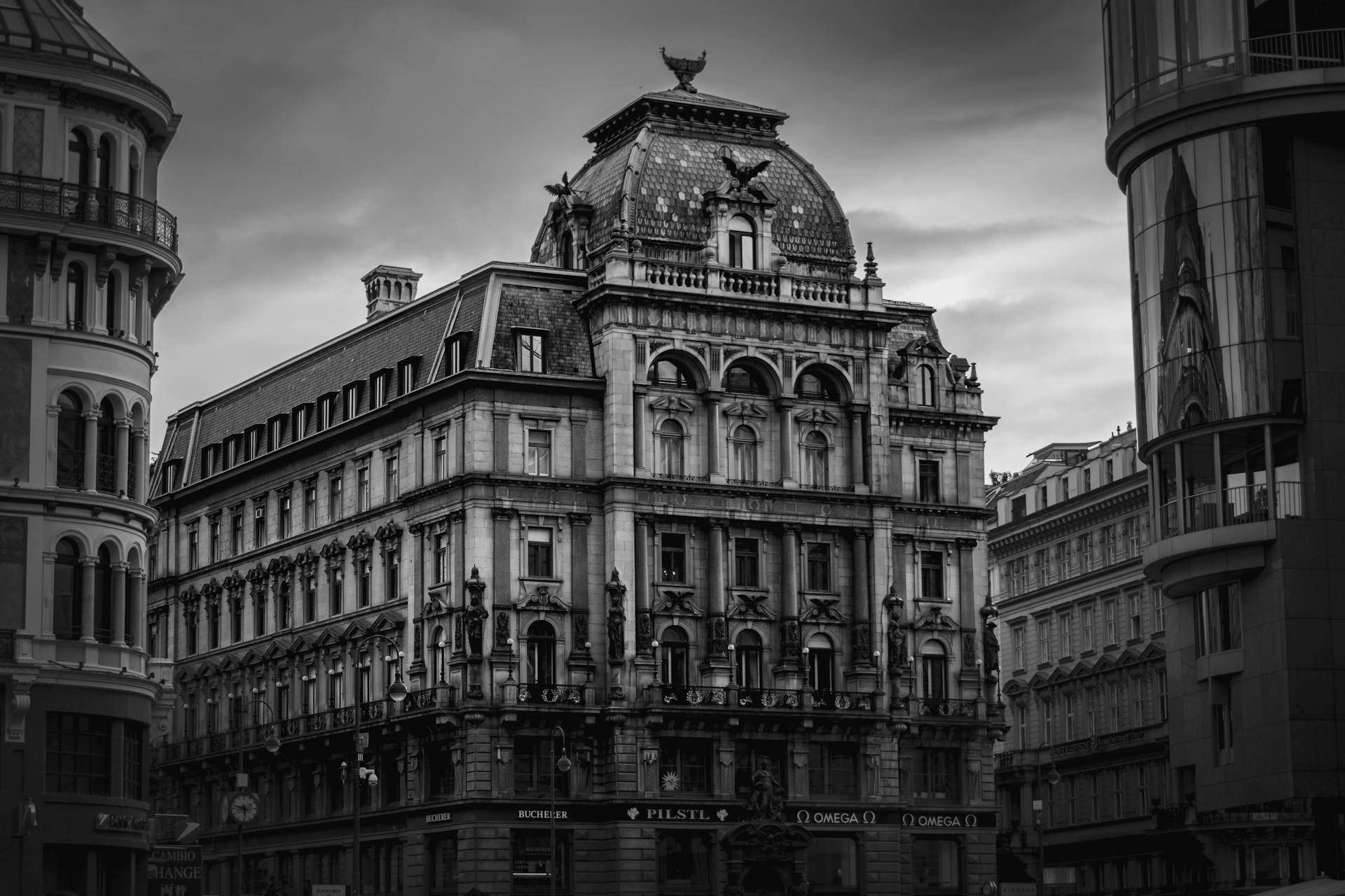 Dramatic black and white photo of Palais Equitable facade in Vienna, Austria.