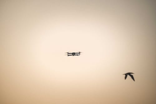 Silhouette of Drone Flying in the Sky