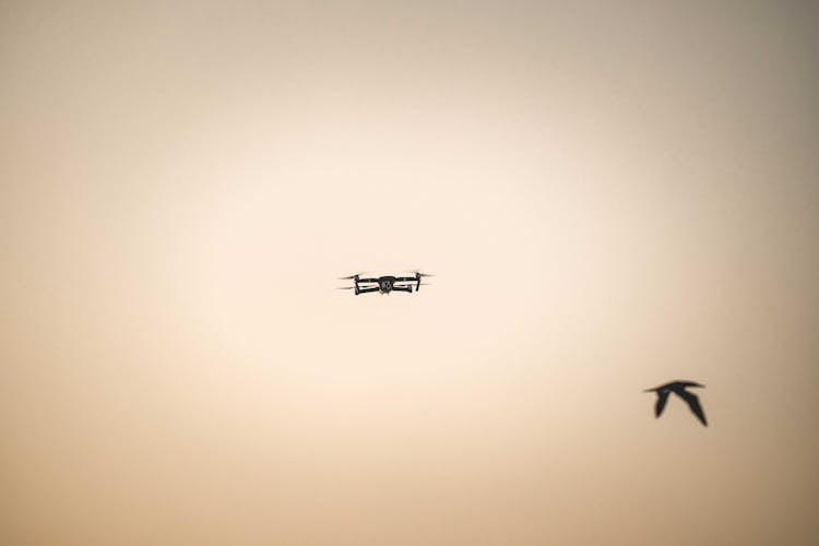 Silhouette Of Drone Flying In The Sky