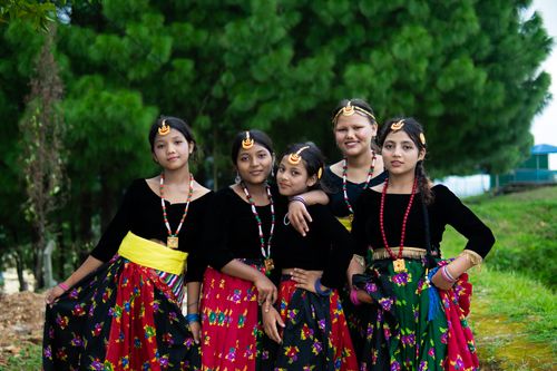 Free A group of young Nepalese girls in traditional clothing pose outdoors, exuding cultural beauty and youth. Stock Photo