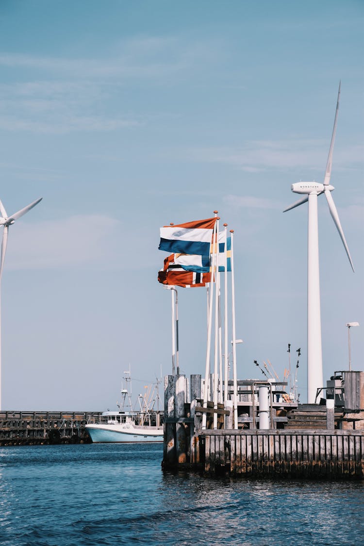 Wind Turbines Alternative Energy Power In Port Of Grenaa Denmark
