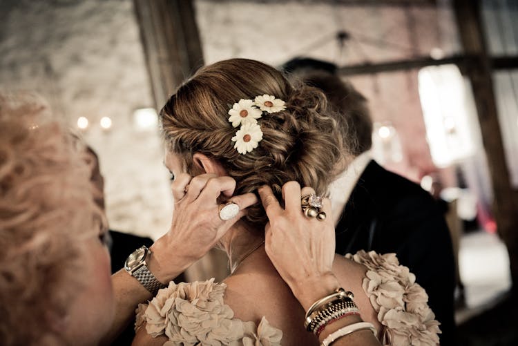 Woman Fixing Other Woman's Hair