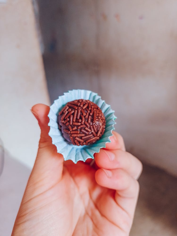 Person Holding A Brigadeirio Brazilian Dessert