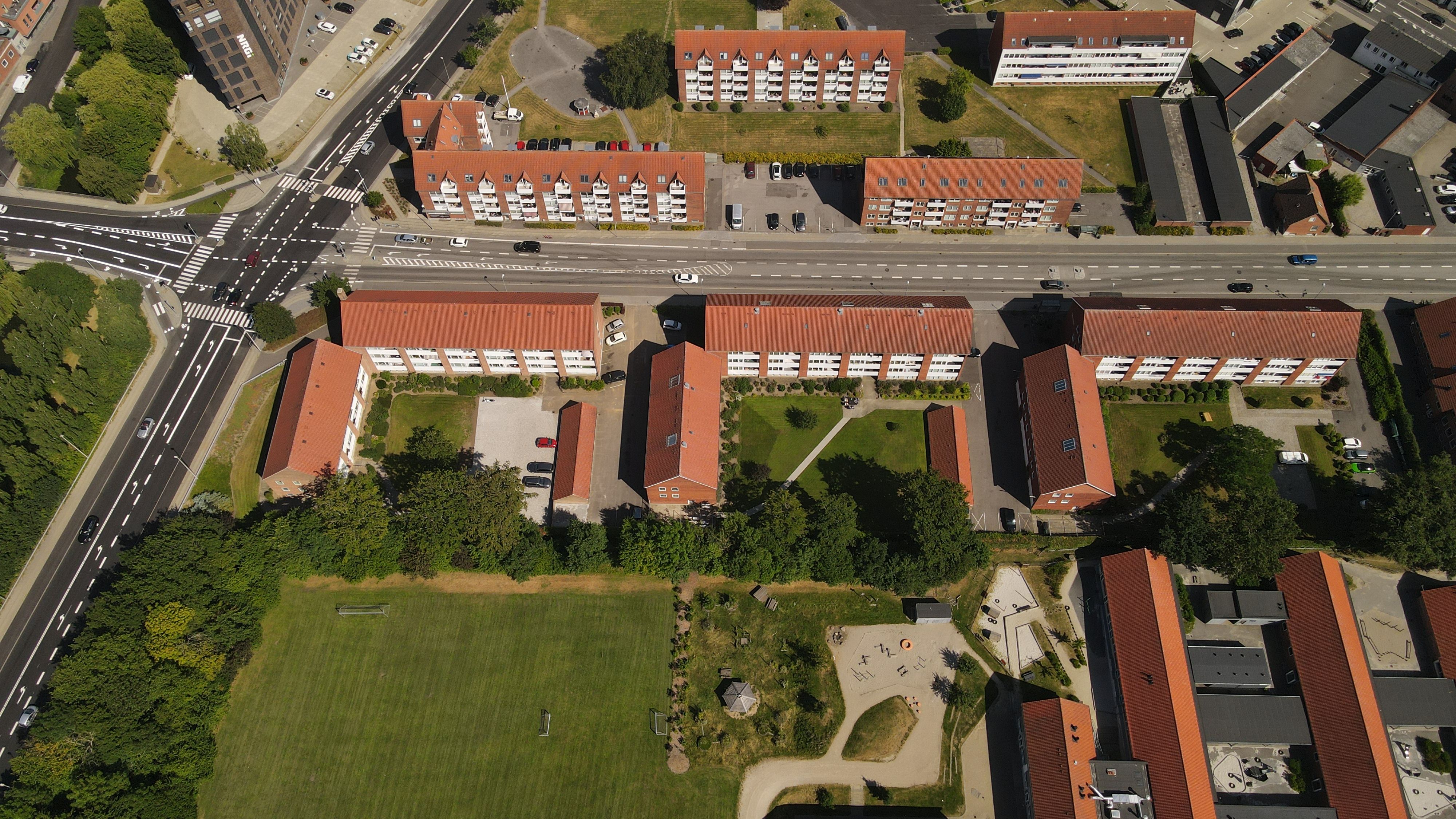 Aerial photo of a residential neighborhood in Horsens, Denmark, showcasing urban planning and green spaces.