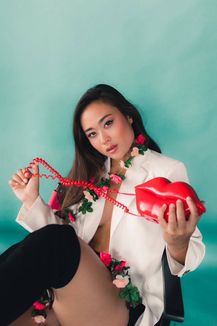 Woman Posing Holding A Purse In The Shape Of Lips 