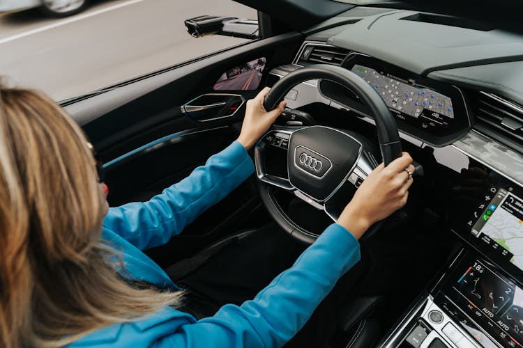 Woman Driving A New Audi Car 