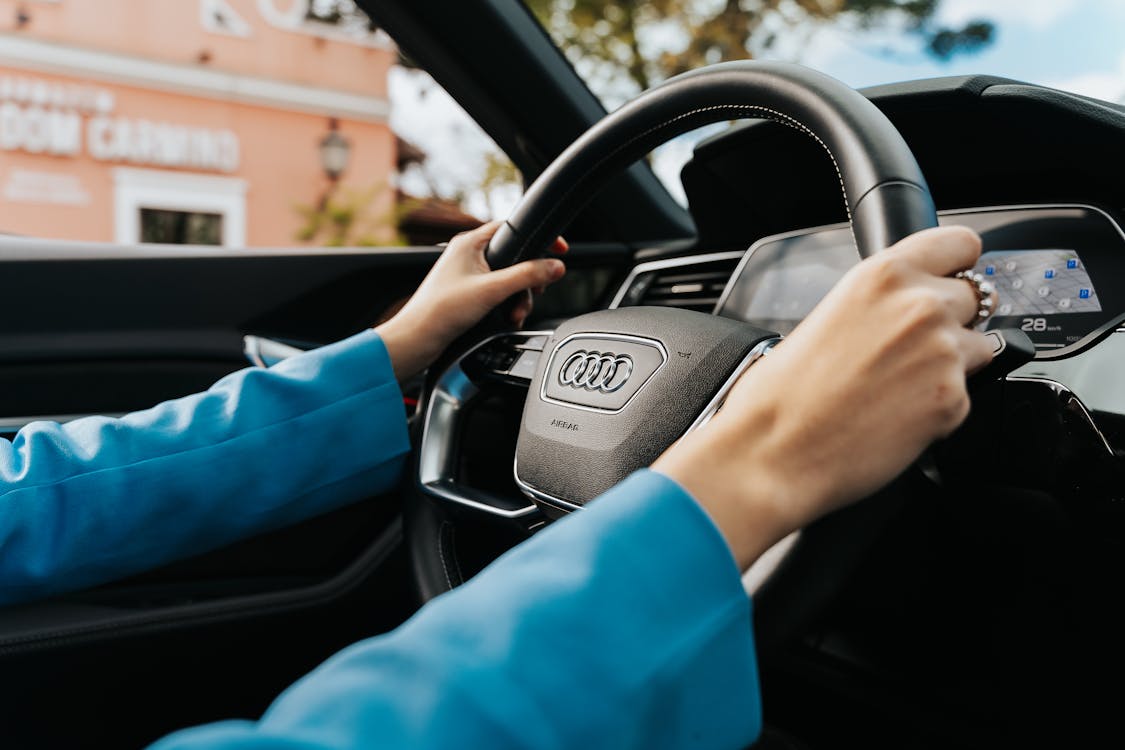 Free Close-up of Woman Holding the Wheel in a New Audi Car Stock Photo sell my lease