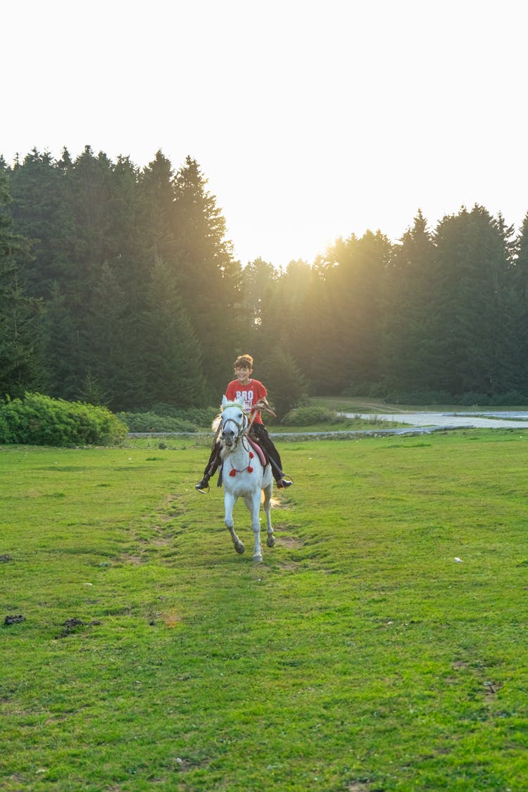 Kid Riding A White Horse