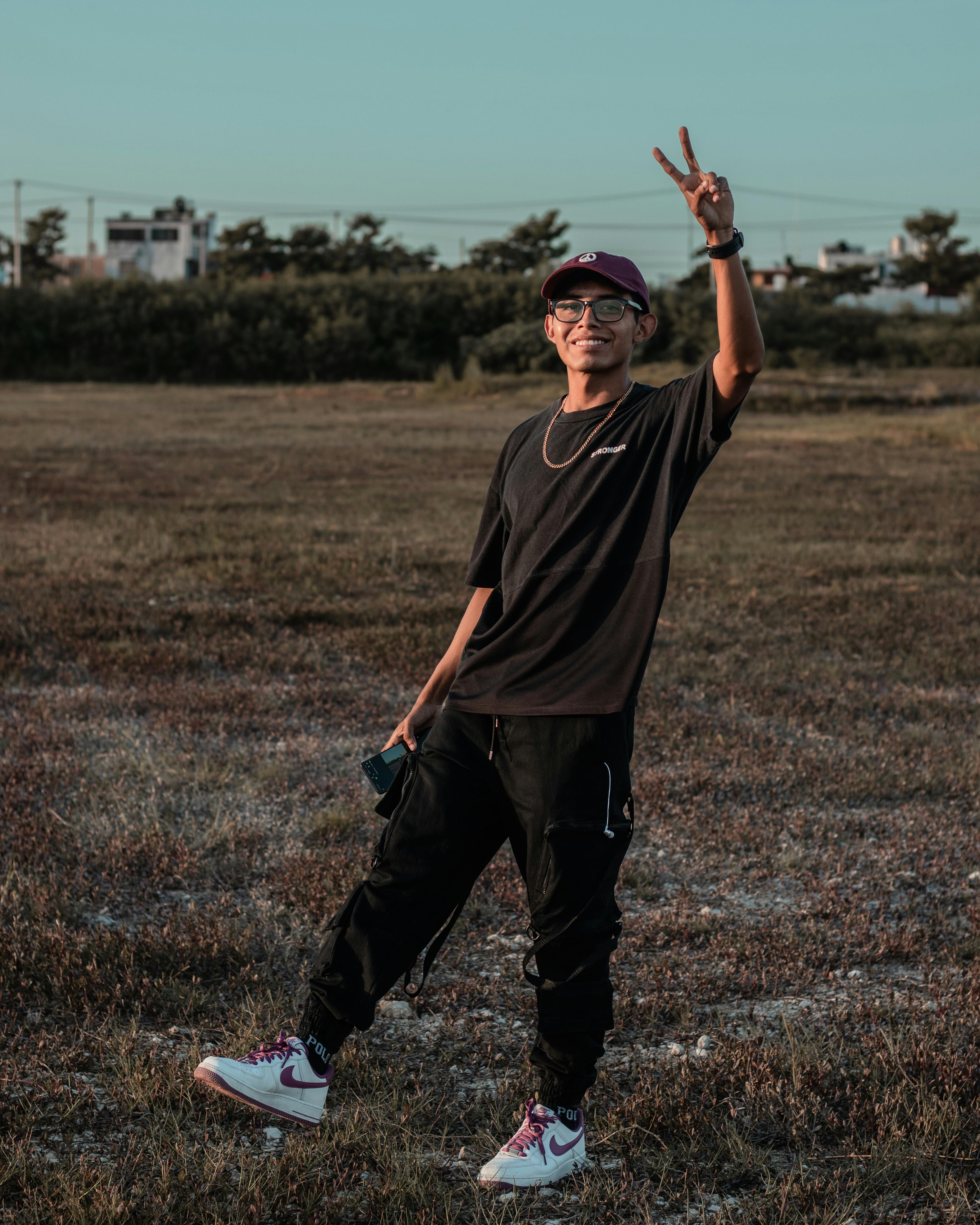 A Man Flashing the Peace Sign · Free Stock Photo