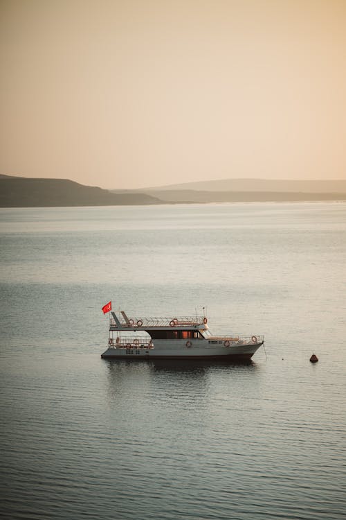 White and Black Boat on Sea