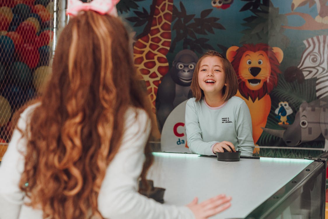 Free Kids Playing Air Hockey Stock Photo