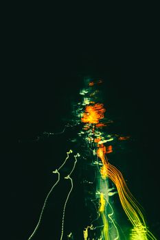 Long exposure shot capturing vibrant light trails at night in Mashhad, Iran.