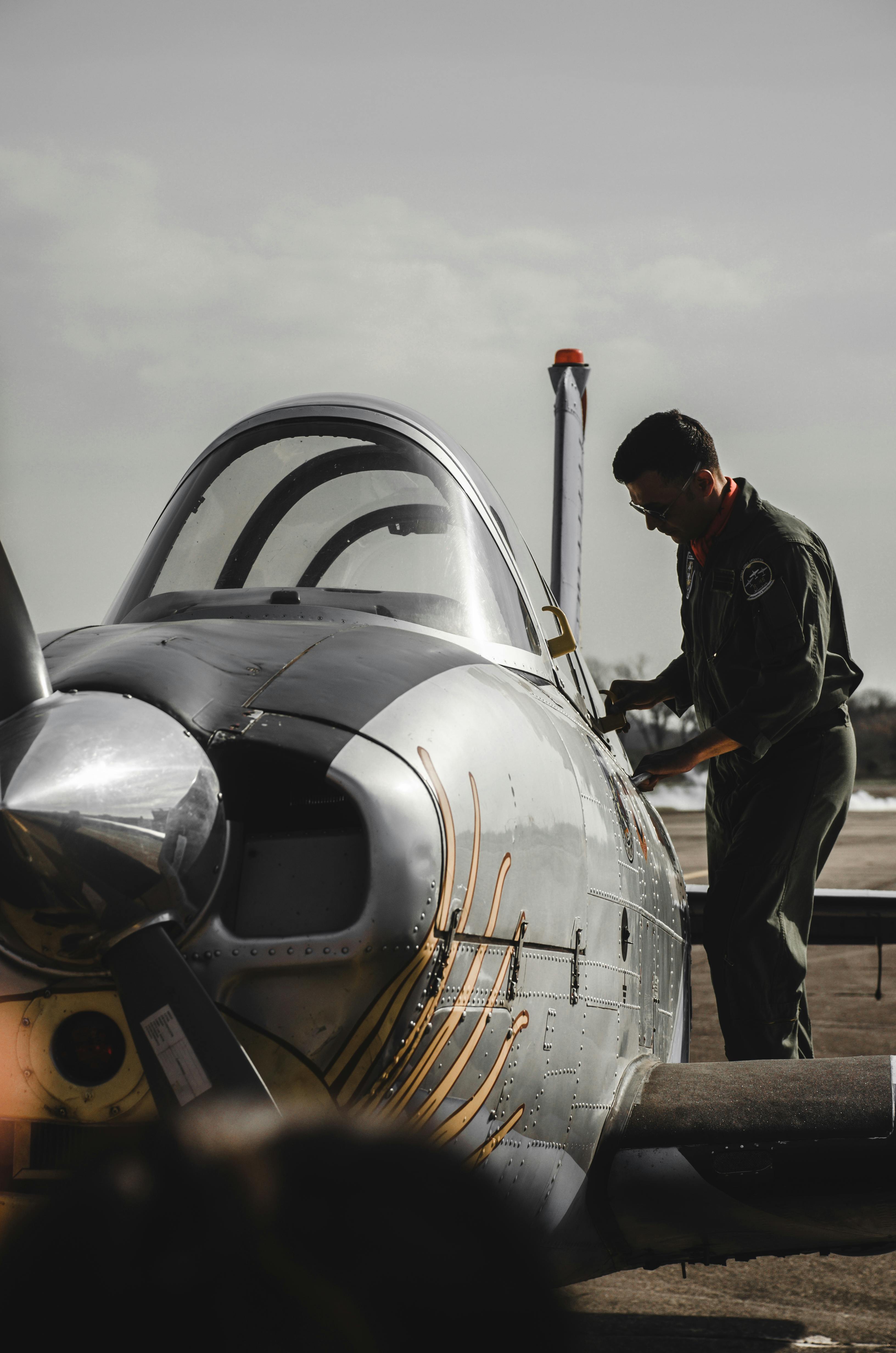 A Man Shaking Hands with a Pilot in an Airplane · Free Stock Photo
