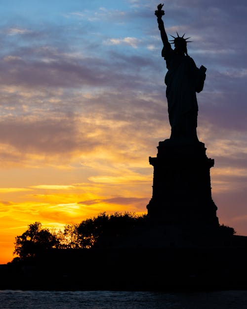 Free Statue of Liberty Silhouette at Sunset Stock Photo