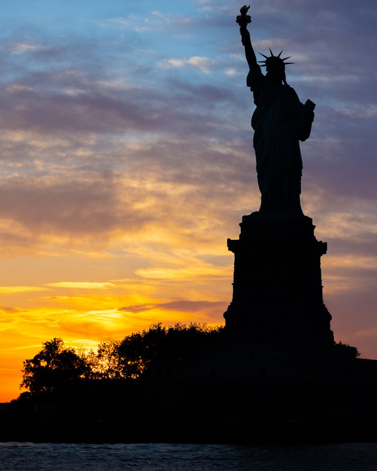 Statue Of Liberty Silhouette At Sunset